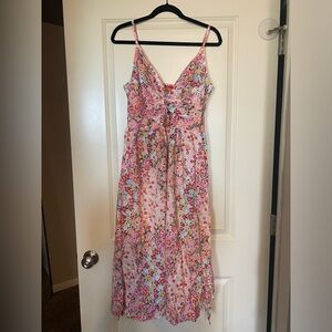 Gorgeous summer sun dress. Detailing on chest and slits on both legs.